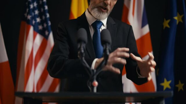 Annoyed politician speaking emotionally at international summit, angry speech