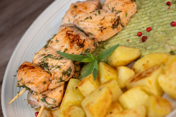 Barbecued salmon skewer with potatoes and broccoli Puree, High quality photo