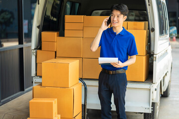 Asian delivery man work in truck for checking the product in the truck, concept ecommerce.