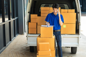 Asian delivery man work in truck for checking the product in the truck, concept ecommerce.