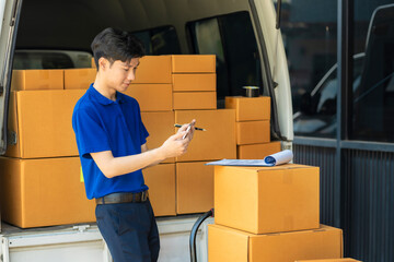 Asian delivery man work in truck for checking the product in the truck, concept ecommerce.