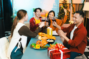 drinks and conversation, social gathering and get together at New Year young people, group and gift exchange at the event, celebration at home.