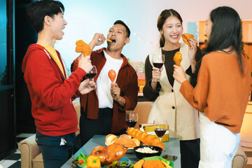 drinks and conversation, social gathering and get together at New Year young people, group and gift exchange at the event, celebration at home.