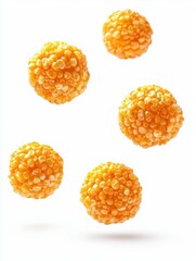 Fototapeta premium Close-up of crunchy caramel-coated popcorn balls isolated against a white background, capturing the texture and golden caramel glaze. Ideal for food themes, snack promotions, and gourmet treats.