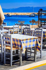 Sea view, cafe tavern tables and mountain peaks panorama in Messinia, Peloponnese, Greece