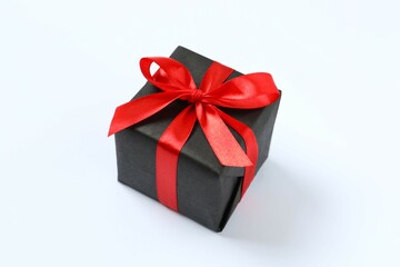 Beautiful gift box tied with bow on white background 