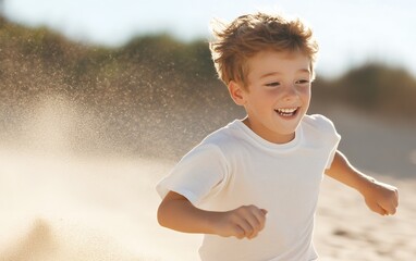 Joyful young boy running on a sandy beach, kicking up sand as he enjoys a sunny day