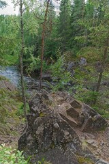  Karelia, Russia, July 11, 2024. Sharp granite stones on the river bank.