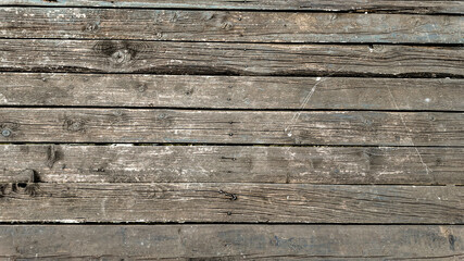 Obraz premium Weathered wooden planks exhibit textures ideal for illustrating rustic design concepts or construction and maintenance issues