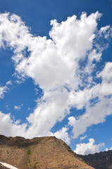 Idyllic summer landscape in the mountains with beautiful rocks and clouds. Terskey Alatoo mountains