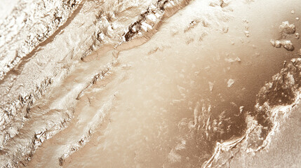 Textured gold surface with rough metallic accents and organic patterns. Minimal background for design. Stylish copy space