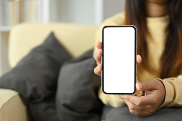 Close up of hands presenting a blank screen on smartphone for digital content