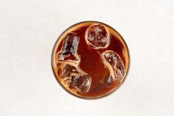 Glass of iced bumble coffee drink with orange juice