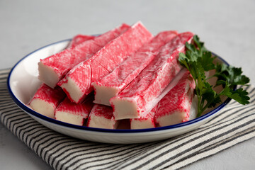 Organic Imitation Crab Meat Sticks on a Plate, side view.