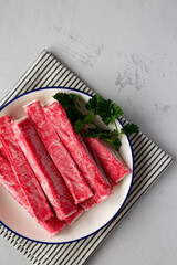 Organic Imitation Crab Meat Sticks on a Plate, top view. Flat lay, overhead, from above. Copy space.