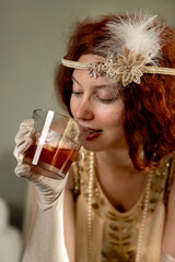 1920s woman smiling with drink