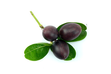 Group of ripe Bengal-currants, Carandas-plum, Karanda,and green leaves isolated on white background top view flat lay.stacking