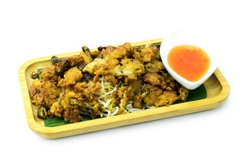 Mussel fried in egg batter or Mussel omelette with cook bean spouts and sweet sauce in wooden tray isolated on white background close up stacking. Street food in Thailand