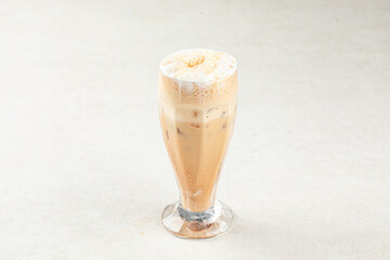Glass of sweet iced coffee shake with milk
