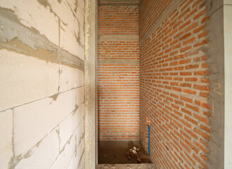 Under construction home or house with scaffolding on site in village. Old unfurnished rental property, living space units. lifestyle. Renovation.