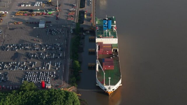 Aerial view of huge cargo ship at Puerto Zarate terminal. Economic growth. Argentina. 4k.