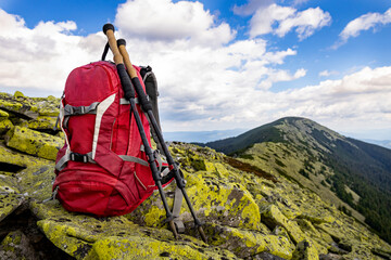 Hiking in the mountains with a backpack in summer.