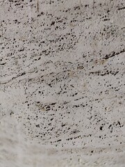 Textured travertine stone wall exterior