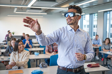 University professor using virtual reality headset teaching students futuristic technologies