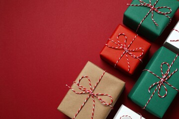 Beautiful gift boxes tied with bows on color background 