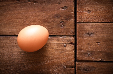 Egg on a rustic wooden board