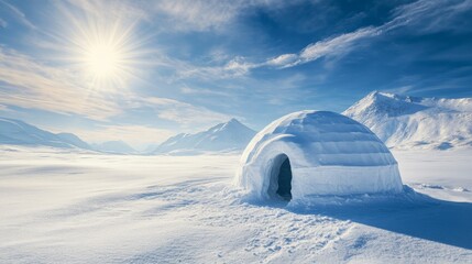 Sunlit igloo in a snowy arctic landscape with mountains under a clear sky, symbolizing isolation, survival, and tranquility in nature