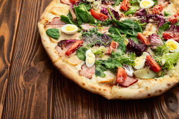 Italian pizza caesar with eggs salad chicken tomatoes and mozzarella photography. top view