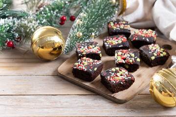 Christmas brownie on wooden table. Copy space