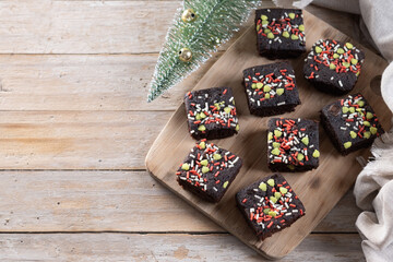 Christmas brownie on wooden table. Top view. Copy space