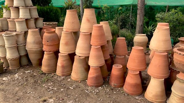 New empty handmade clay flowerpots for plants in shop for sale