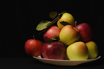 Autumn fresh natural ecologically clean farm apples in a plate.