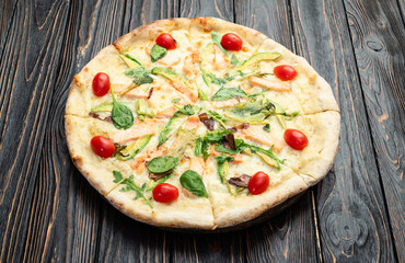 Italian pizza with avocado salmon  tomatoes and mozzarella photography. top view