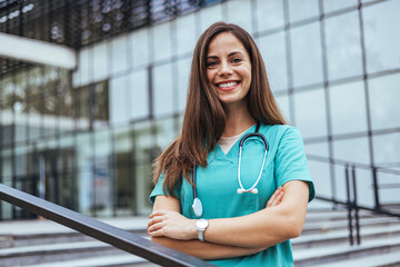 Confident Nurse Standing Outside Modern Healthcare Facility