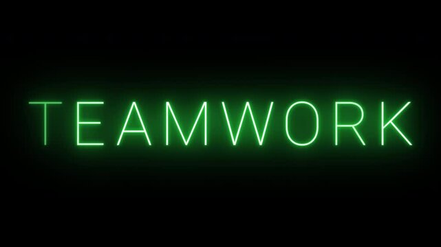 Flickering neon green glowing teamwork sign animated black background