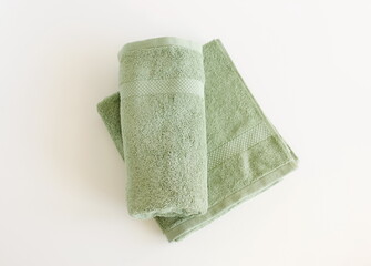 Bath towels green color top view  isolated on white background. Copy space. Kashmir color 2025