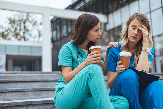Empathetic Nurse Offering Support to Stressed Medical Colleague