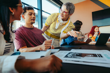 College lecturer explaining concepts to students in a classroom setting, fostering engagement and discussion with diverse group