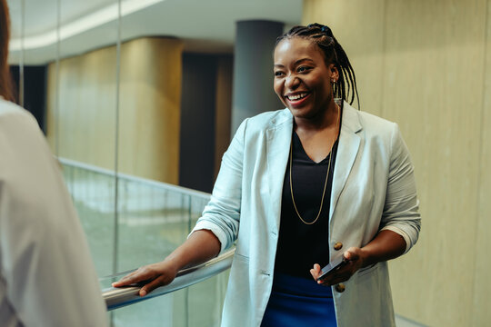 Confident professional in a corporate setting with a smile