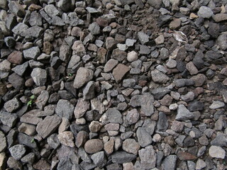 Natural Background Collection of Sharp Split Gravel Stones in Gray and Black Colors Containing Coal and Coarse Textured Granite for Concrete. Industrial Recycled Natural Gravel. Closeup Photography