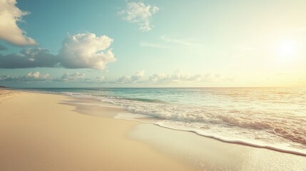 Fototapeta premium Deserted sandy beach along a summertime ocean featuring ample negative space for text or graphics