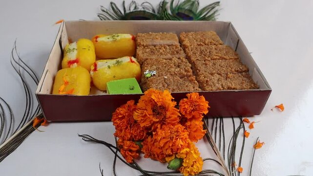 Cham cham and milkcake (kalakand), traditional Indian sweets, served together on a tray, perfect for festive celebrations and special occasions, adding sweetness to gatherings. Selective focus 