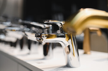 Rows of new faucets in plumbing shop