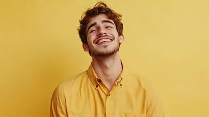 Fototapeta premium Photo of nice young man beaming smile wear shirt isolated on yellow color background
