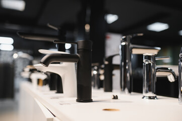 Modern kitchen and bathroom water faucets in the store