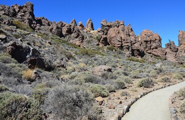 Scenic view of volcanic rock formations in desert during sunny day, Teide National Park, Tenerife